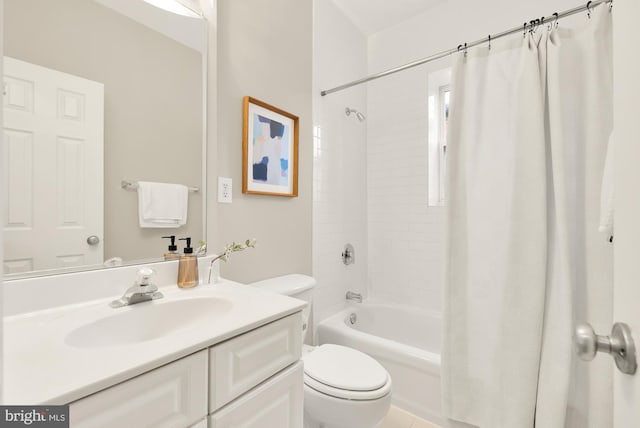 bathroom with toilet, shower / tub combo with curtain, and vanity