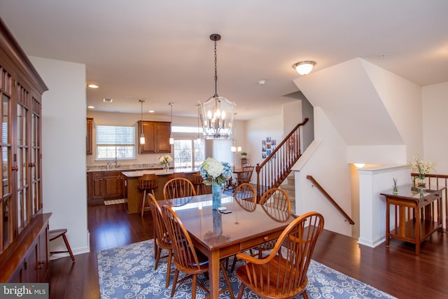 dining room featuring visible vents, dark wood-type flooring, stairs, a notable chandelier, and recessed lighting