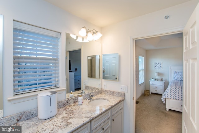 bathroom featuring vanity and baseboards