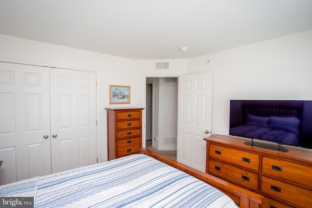 bedroom featuring a closet and visible vents