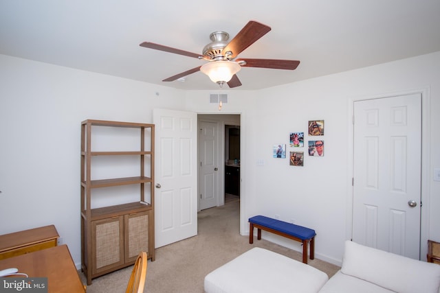 bedroom with visible vents, ceiling fan, and light carpet