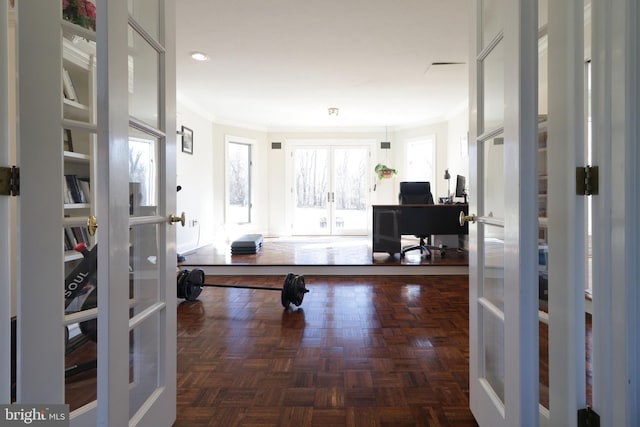 interior space featuring french doors and crown molding