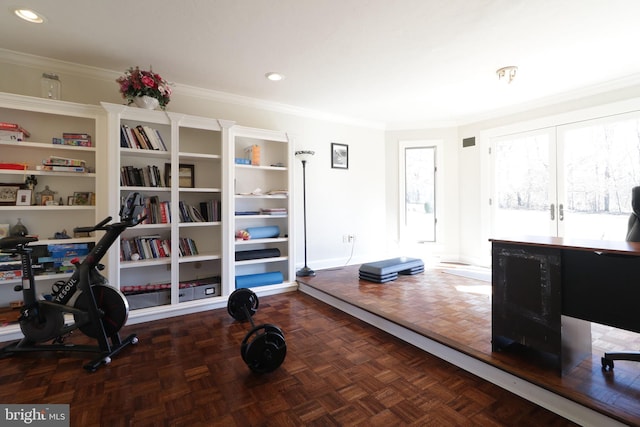 exercise area with crown molding and recessed lighting