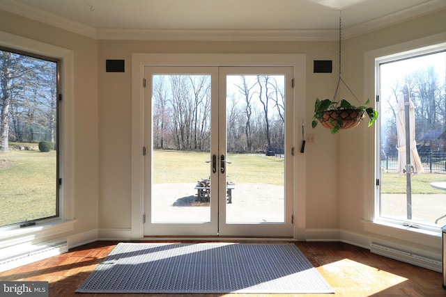 doorway featuring baseboards, a baseboard heating unit, french doors, and crown molding