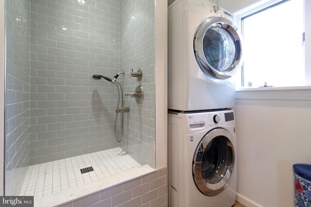 laundry area with laundry area and stacked washer / dryer