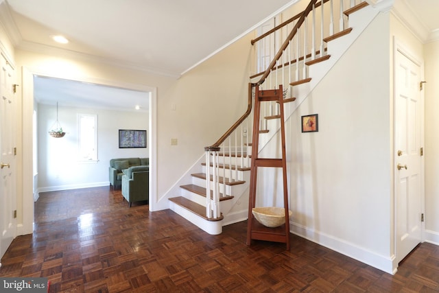 stairway featuring crown molding, recessed lighting, and baseboards