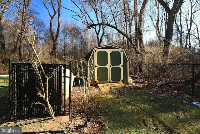 view of shed featuring fence