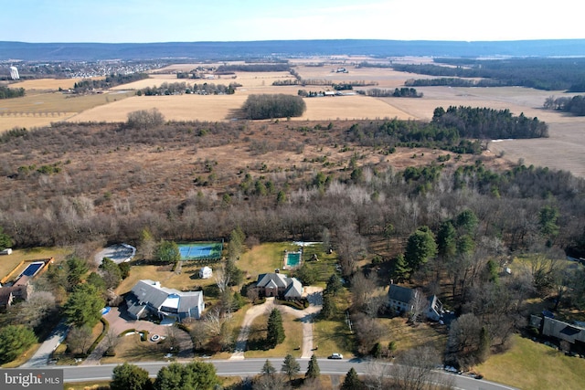 birds eye view of property featuring a rural view