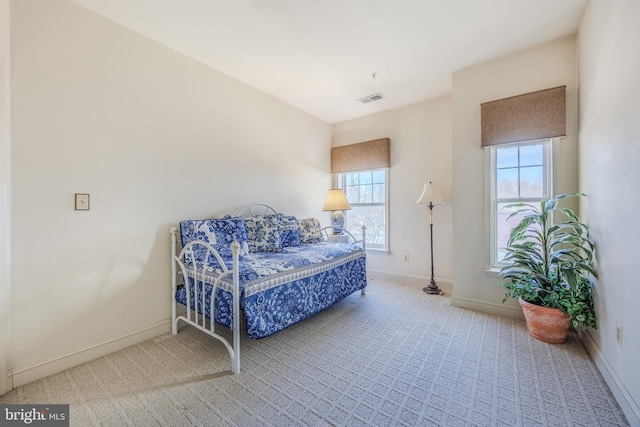 living area featuring visible vents and baseboards