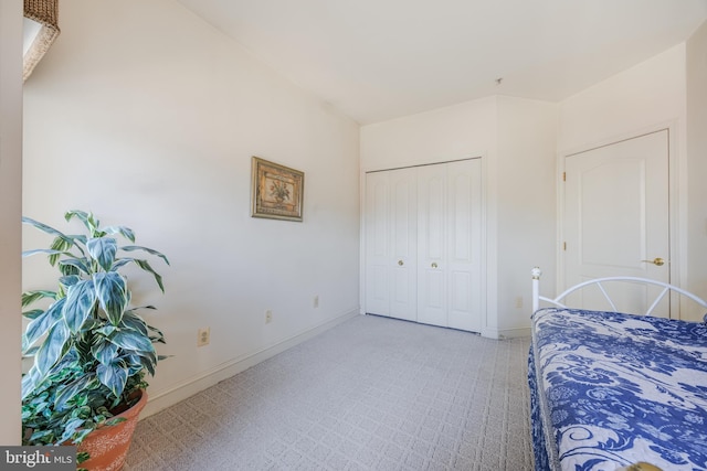 bedroom with a closet and baseboards