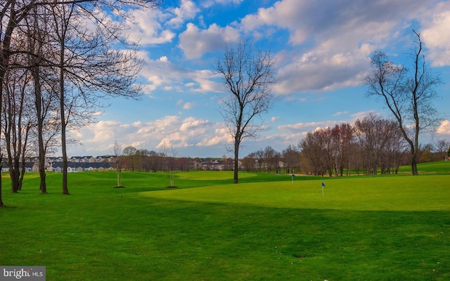 view of property's community featuring a yard