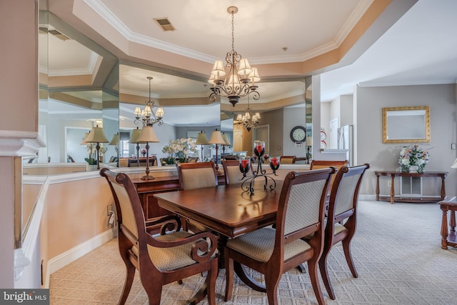 dining space with a chandelier, light colored carpet, ornamental molding, and visible vents