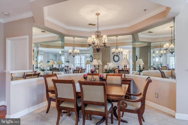 dining space with crown molding, baseboards, visible vents, and an inviting chandelier