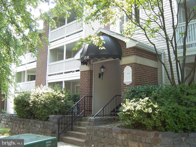 view of front of property featuring brick siding