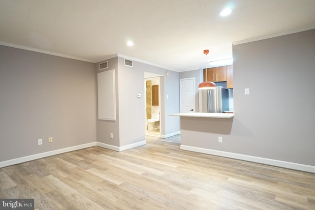 unfurnished living room with light wood-type flooring, baseboards, and visible vents