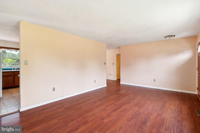 6621 Schoolhouse Rd, Bealeton, VA 22712 - unfurnished room with wood finished floors, baseboards, and a sink