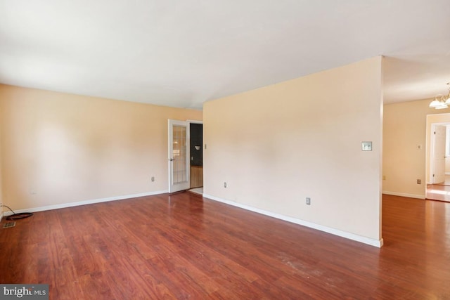 6621 Schoolhouse Rd, Bealeton, VA 22712 - spare room featuring wood finished floors, a chandelier, and baseboards
