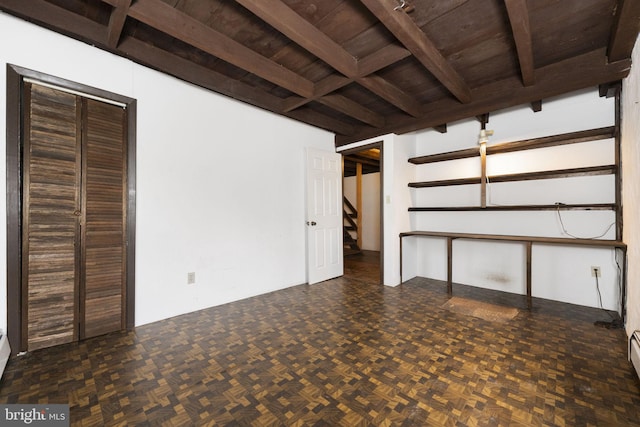 basement with stairway and wooden ceiling