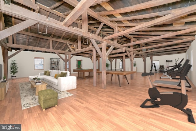 interior space with lofted ceiling and wood finished floors