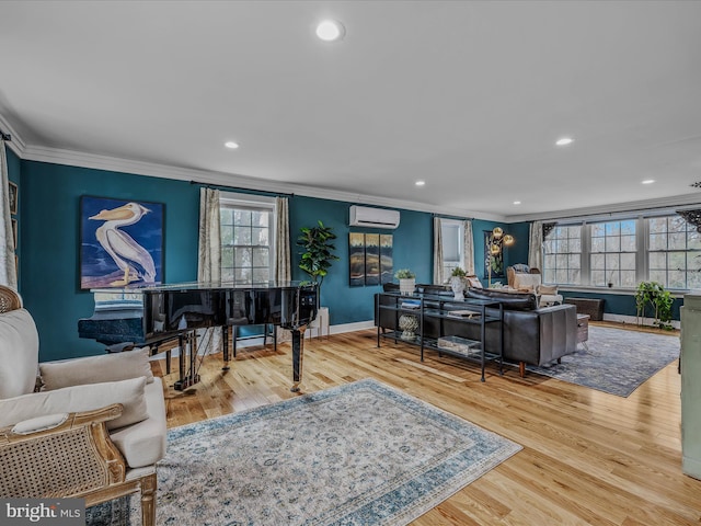 living area with baseboards, ornamental molding, wood finished floors, an AC wall unit, and recessed lighting