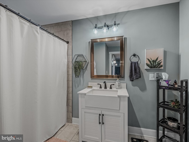 full bath with a shower with shower curtain, baseboards, and vanity