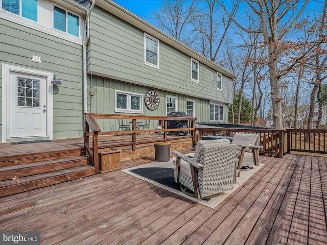 wooden deck featuring area for grilling