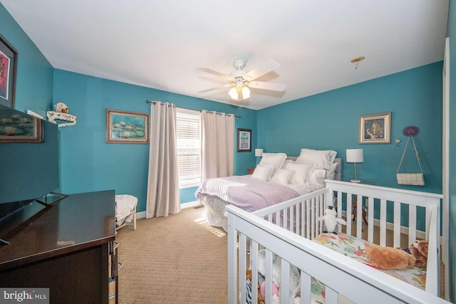 bedroom featuring carpet, baseboards, and ceiling fan