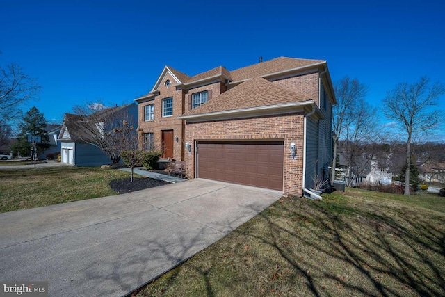 view of front facade with driveway, a shingled roof, an attached garage, a front lawn, and brick siding