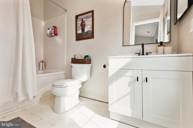 full bath featuring vanity, shower / bath combination with curtain, and toilet