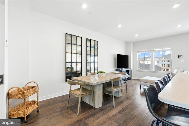 dining room with recessed lighting, baseboards, and dark wood-style flooring