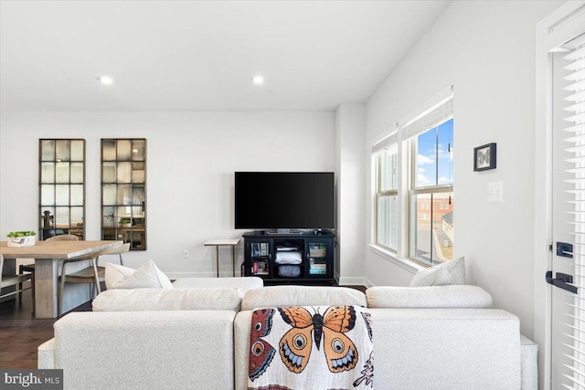 living area with recessed lighting, baseboards, and dark wood-style floors