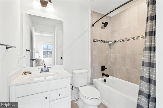 bathroom with shower / tub combo, toilet, ensuite bathroom, and vanity