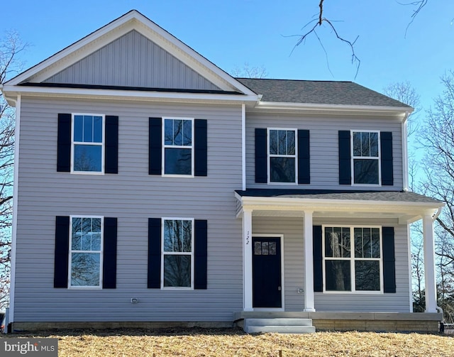 view of front of house with covered porch and roof with shingles