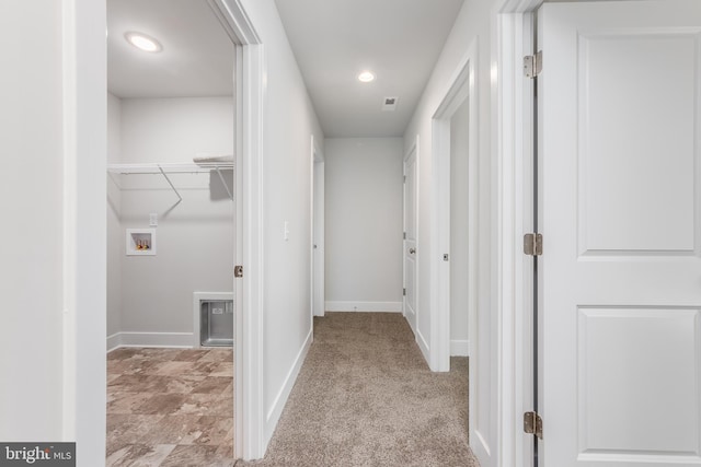 hall with light carpet, visible vents, baseboards, and recessed lighting