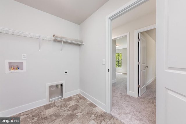 laundry room featuring washer hookup, light carpet, electric dryer hookup, laundry area, and baseboards