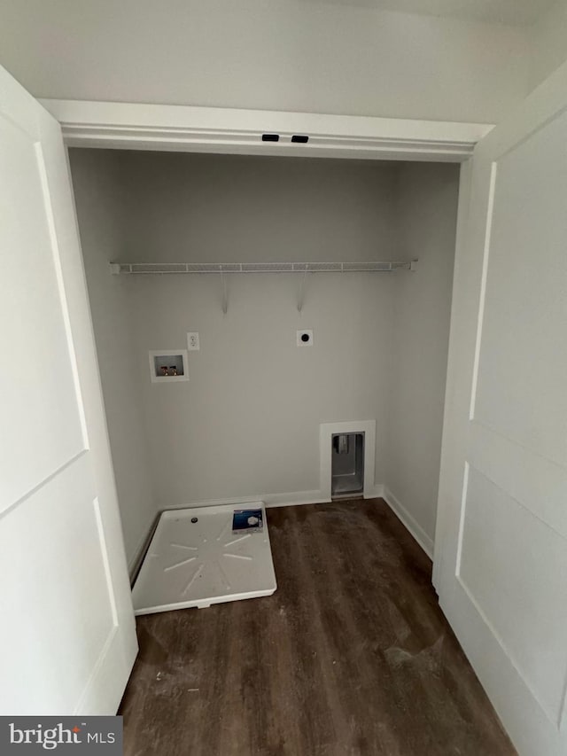 clothes washing area with dark wood-style floors, laundry area, hookup for a washing machine, and electric dryer hookup