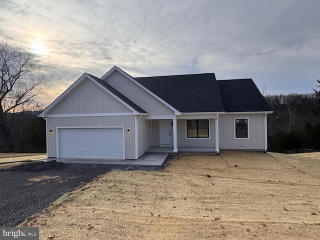 view of front of property featuring a garage and driveway