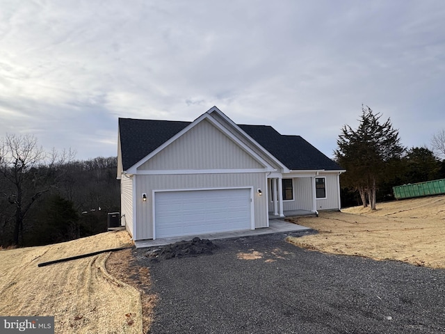 single story home with driveway and an attached garage