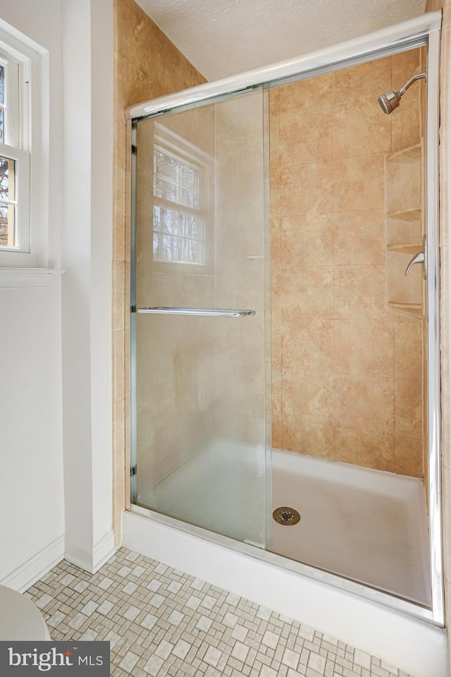 bathroom featuring a stall shower