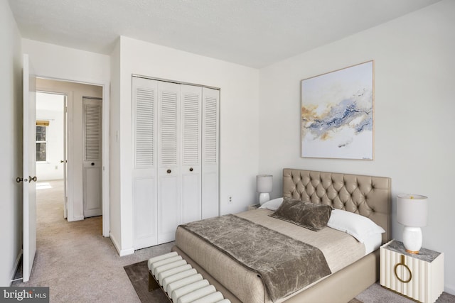 bedroom featuring a closet and carpet