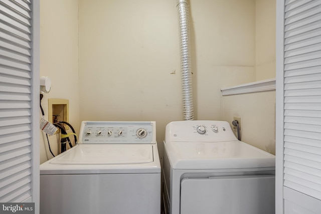 clothes washing area featuring laundry area and independent washer and dryer