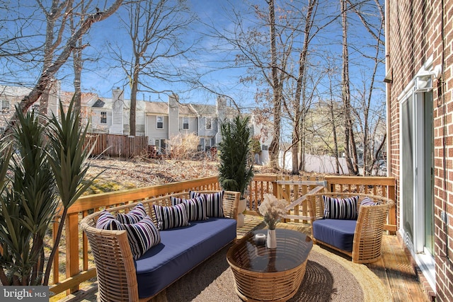 wooden terrace with a residential view and outdoor lounge area