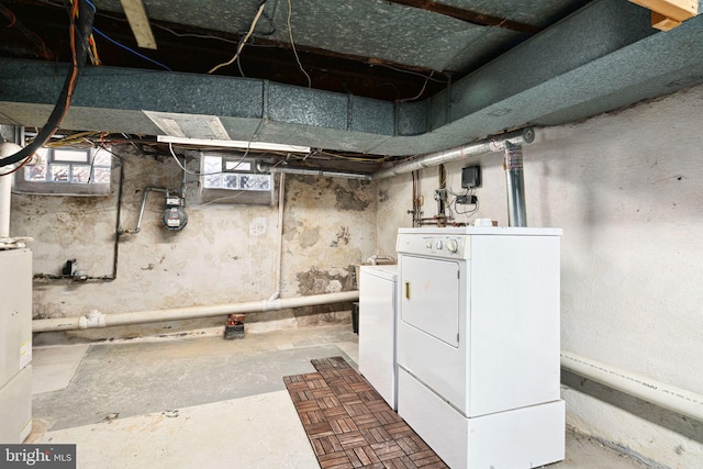 below grade area featuring washer and dryer