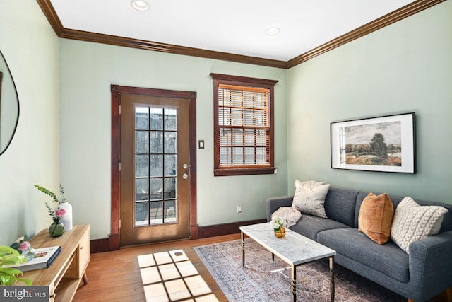 living area featuring ornamental molding, recessed lighting, baseboards, and wood finished floors