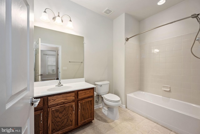 full bath featuring baseboards, visible vents, toilet, vanity, and shower / washtub combination