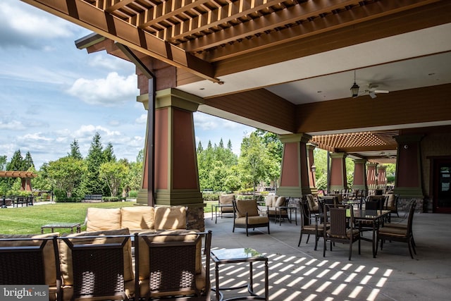 view of patio featuring a ceiling fan, outdoor dining area, outdoor lounge area, and a pergola