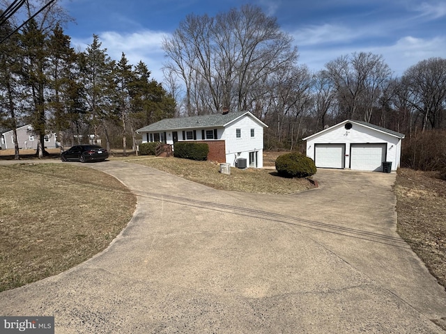 view of side of property featuring central AC, a detached garage, and an outdoor structure