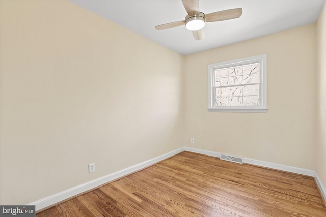 unfurnished room featuring visible vents, baseboards, light wood-style floors, and a ceiling fan