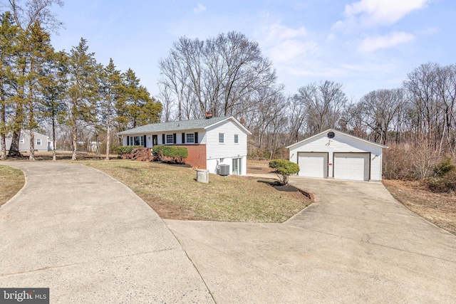 single story home with an outbuilding, a front lawn, cooling unit, a garage, and a chimney