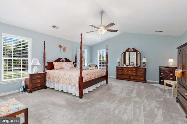 bedroom featuring visible vents, multiple windows, and lofted ceiling